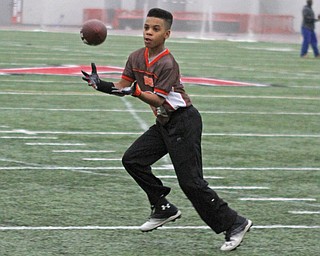 Preston Mays runs a route during practice for the 9-10 year old YYFFA team on Wednesday night at the WATTS.  Dustin Livesay  |   The Vindicator  1/13/16  YSU, WATTS