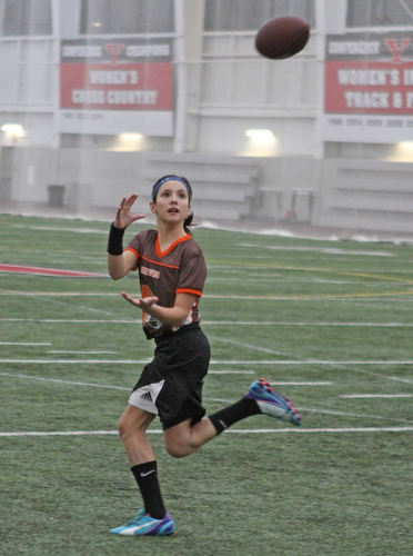 Gabby Lamparty looks to make a catch during practice for the 9-10 year old YYFFA team on Wednesday night at the WATTS.  Dustin Livesay  |   The Vindicator  1/13/16  YSU, WATTS