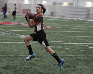 Gabby Lamparty makes a catch during practice for the 9-10 year old YYFFA team on Wednesday night at the WATTS.  Dustin Livesay  |   The Vindicator  1/13/16  YSU, WATTS