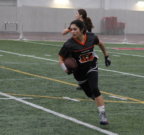 Olivia Alfano runs with the ball during practice for the 10-11 year old YYFFA team on Wednesday night at the WATTS.  Dustin Livesay  |   The Vindicator  1/13/16  YSU, WATTS
