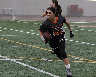 Olivia Alfano runs with the ball during practice for the 10-11 year old YYFFA team on Wednesday night at the WATTS.  Dustin Livesay  |   The Vindicator  1/13/16  YSU, WATTS