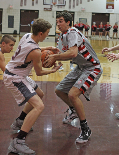 Boardman's Holden Lipke (3) fights for a loose ball with Canfield's Sam Digiacomo (42) during the second quarter of Friday nights matchup at Boardman High School.  Dustin Livesay  |  The Vindicator  1/22/16  Boardman High School.