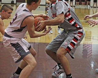 Boardman's Holden Lipke (3) fights for a loose ball with Canfield's Sam Digiacomo (42) during the second quarter of Friday nights matchup at Boardman High School.  Dustin Livesay  |  The Vindicator  1/22/16  Boardman High School.
