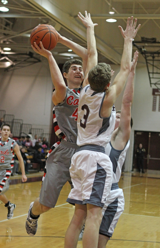 Canfield's Mason Mangapora (44) attempts to go up for a shot but is closely defended by Boardman's Holden Lipke (3) during the second quarter of Friday nights matchup at Boardman High School.  Dustin Livesay  |  The Vindicator  1/22/16  Boardman High School.