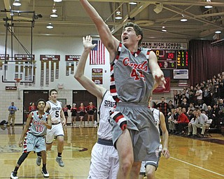 Canfield's Mason Mangapora (44) goes up for a layup while being defended by Boardman's Holden Lipke (3) during the second quarter of Friday nights matchup at Boardman High School.  Dustin Livesay  |  The Vindicator  1/22/16  Boardman High School.