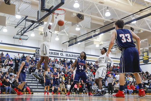 Harding's Derek Culver (1) dunks the ball over Fitch's Dominic Difrancesco (23) and Bryce Hall (24) during their game at Harding High School, Friday, Jan. 22, 2016, in Warren, Ohio. Alex Slitz for The Vindicator