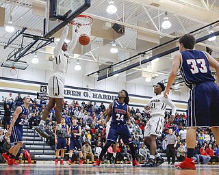 Harding's Derek Culver (1) dunks the ball over Fitch's Dominic Difrancesco (23) and Bryce Hall (24) during their game at Harding High School, Friday, Jan. 22, 2016, in Warren, Ohio. Alex Slitz for The Vindicator