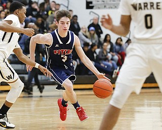 Fitch's Scotty Duffy (3) drives past Harding's Gabe Simpson (4) during their game at Harding High School, Friday, Jan. 22, 2016, in Warren, Ohio. Alex Slitz for The Vindicator