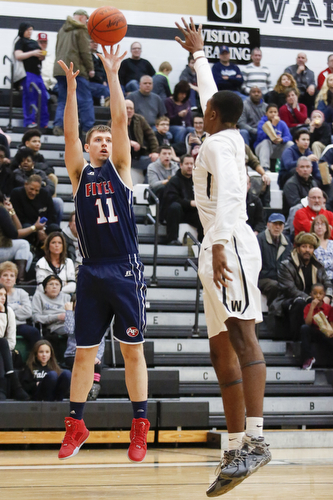 Fitch's Anthony Pangio shoots past Harding's Derek Culver (1) during their game at Harding High School, Friday, Jan. 22, 2016, in Warren, Ohio. Alex Slitz for The Vindicator