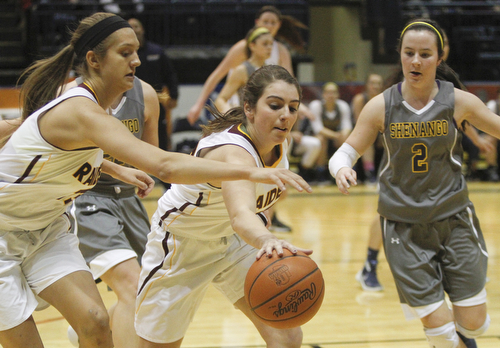      ROBERT K. YOSAY  | THE VINDICATOR..SR #23  Taylor Naples  takes a rebound as #13  Maddie Durkin gets a hand in as Shenango's #2  Carolyn Peterson looks on  during second quarter action.. as  South Range vs Shenango @ Covelli...--30-...