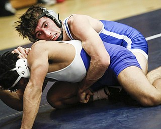 Poland's David Escaro, top, wrestles Ravenna's Tony Lewis during their 145 pound match during the 2016 Josh Hephner Memorial Tournament at Austintown-Fitch High School, Saturday, Jan. 23, 2016, in Youngstown, Ohio. Alex Slitz for The Vindicator