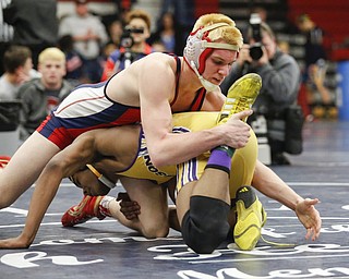 Fitch's Kyle Varga, top, wrestles Jackson's Braxton Freeman during their 160 pound match during the 2016 Josh Hephner Memorial Tournament at Austintown-Fitch High School, Saturday, Jan. 23, 2016, in Youngstown, Ohio. Alex Slitz for The Vindicator