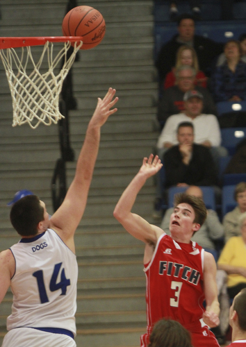 William D Lewis The Vindicator  Fitch's Fitch's scotty duffy(3) shoots over  Poland's Jacob Burns(14) during 1-26-16 action in Poland.