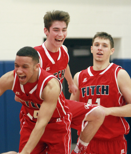 William D Lewis The Vindicator  Fitch's RandySmith(14), Scotty duffy(3) and Anthony Pangio(11) celebrate after beating Poland .