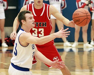 William D Lewis The Vindicator  Fitch's Brian Beany (33) defends as Poland's Jared Burkert(23)  during 1-26-16 action in Poland.