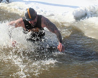 SPECIAL TO THE VINDICATOR
The Humane Society of Columbiana County and the Hanover Township and Winona volunteer fire departments have teamed to host the second annual Plunge for Rescue event at 2 p.m. Saturday at the East Lake Road boat ramp at Guilford Lake in Lisbon. Doug Brannon of Team Salem VFW, above, is shown braving the frigid waters of the lake during the 2015 plunge. This year’s event will include training exercises and rescue demonstrations by the fire departments at 10 a.m., plunge registration at noon and Sparky the Fire Dog’s arrival at 1 p.m. Plunge entrants must make a minimum $25 donation to participate; those who donate $100 or more will receive official gear. Team activity is encouraged, and prizes will be awarded for biggest team jump, as well as most outrageous costume, biggest fundraiser and most creative plunge style. Preferred seating to watch the plunge at the Guilford Lake Grille will be $10. Registration and donation forms are available at the HSCC shelter, 1825 S. Lincoln Ave., Salem, or on the HSCC Facebook event page. All proceeds will benefit the pets in the care of the shelter. For information call Jill Halligan at 330-592-4623 or the shelter at 330-332-2600.