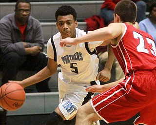 William D Lewis The Vindicator East"s C. Backus(5) drives around Fitch'sDom difrancesco(23) during 1-29-16 game at East.