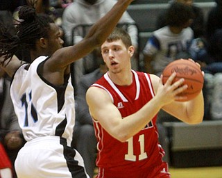 William D Lewis The Vindicator EFitch's Anthony Pangio(11) keepstheball from East'a J.Mixon(11) during 1-29-16 game at East.