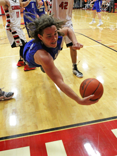 Poland's Nick Buccieri (15) dives to save the ball from going out of bounds during Friday nights matchup against Canfield at Canfield High School.  Dustin Livesay  |  The Vindicator  1/29/16  Canfield High School.