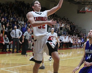 Canfield's Julian Vitto (32) takes an easy layup during Friday nights matchup against Poland High School at Canfield High School.  Dustin Livesay  |  The Vindicator  1/29/16  Canfield High School.