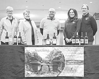 Katie Rickman | The Vindicator.Local winery owners from across the Mahoning Valley pose for a photo at Stambaugh Auditorium where a wine tasting event will be held at a later date from left: Shelia Fisher and Debbie Beltz of Country Porch Winery in Cortland; Dan Mastropietro of Mastropietro Winery in North Jackson; and Denise and Dale Bliss of Green Eagle Winery in Cortland on Tuesday, January 26, 2016.