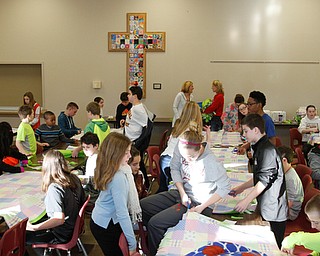      ROBERT K. YOSAY  | THE VINDICATOR..St. Charles School students huddled around tables in the cafeteria busying themselves with measuring, cutting and tying for a good cause..The fifth-through-eighth-graders were making blankets Tuesday morning for Making Kids Count, a nonprofit organization that helps children in Mahoning, Trumbull, Columbiana, Ashtabula and Portage counties..--30-...