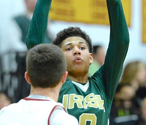 Jeff Lange | The Vindicator  FRI, FEB 5, 2016 - Ursuline's Mike Hughes (0) looks to make a pass during the fourth quarter of the Irish's matchup against Mooney at Cardinal Mooney High School on Friday.