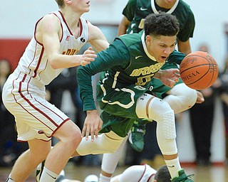Jeff Lange | The Vindicator  FRI, FEB 5, 2016 - Ursuline's Mike Hughes breaks away from Mooney's Pat Pelini late in the fourth quarter of their game at Cardinal Mooney High School on Friday.