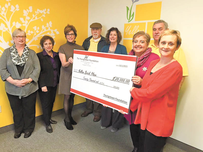 SPECIAL TO THE VINDICATOR | The Youngstown Foundation recently presented a $20,000 check to Yellow Brick Place for a grant to help the cancer support organization with operational costs. Guests at the event included, from left, Carol Apinis and Angie Palumbo, YBP board members; Jan Strasfield, Youngstown Foundation executive director; Jim Aleshire and Denise Keenan, YBP board members; Donna Detwiler and Anna Aey, YBP cofounders; and Dan Lyden, YBP volunteer.