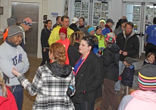 Runners filled the lobby of the Poland Library before the start of the first running of the Paczki Dash 5K on Saturday morning.  Dustin Livesay  |  The Vindicator  2/6/16  Poland, Ohio.