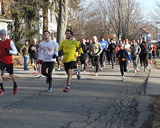 A group of nearly 100 runners flooded the streets outside of the Poland Library to participate in the first running of the Paczki Dash 5K on Saturday morning.    Dustin Livesay  |  The Vindicator  2/6/16  Poland, Ohio.