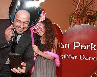 William D Lewis the vindicator Ahmad Musleh and his daughter Mia Musleh, 7, take a selfie during Boardman PArk Father Daughter Dance 2-11-16.
