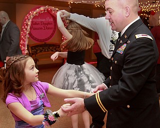 William D Lewis the vindicator Charles Whyde in his national guard uniform dances with his daughter Madison Whyde, 7,during Boardman Park Father Daughter Dance 2-11-16.