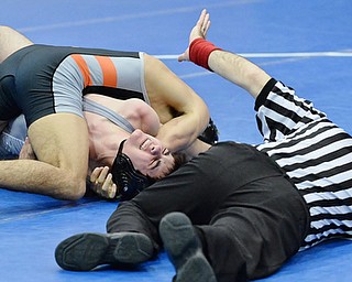 Jeff Lange | The Vindicator  THURS, FEB 11, 2016 - Brandon Olsen of Poland Seminary (facing) winces in pain as he is pinned during his 138 pound match against Howland's Frank Viera at Poland High School on Thursday.