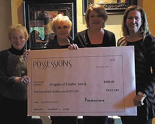 SPECIAL TO THE VINDICATOR | Linda Deckant of Possessions Ladies Clothing and Accessories in Boardman recently presented $500 to the Angels of Easter Seals from the proceeds of the Angels’ Holiday Brunch benefit event. Angels chairmen Sally Reedy, left, and Jacie Ridel, joined Deckant and Angels president Debbie Wilson for the donation.