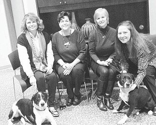 SPECIAL TO THE VINDICATOR | Angels for Animals will host its 11th annual reverse raffle dinner at 6 p.m. March 5 in Andrews Hall at the shelter, 4750 W. South Range Road, Canfield. Dr. Mark McMurray will prepare a gourmet meal, and there will be basket raffles, 50-50, silent auctions, and a drawing for a grand prize worth $2,000. Cost is $75 per person or $25 for dinner only, and all proceeds will benefit Angels for Animals. Organizers preparing for the event include, from left, event chairwoman Stephanie McMurray, board member Lynn Mitchell, financial secretary Janet Flynn and Angels co-founder Diane Less. Geo, left, a 5-year-old mixed breed dog, and Heidi, a 9-month-old Labrador retriever mix, are available for adoption. For information on the event, call Less at 330-502-5352 or visit www.angelsforanimals.org.