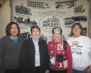 SPECIAL TO THE VINDICATOR | Girard Historical Society recently elected officers for 2016 including, from left, treasurer Patty Finelli Miller, secretary Mary Ann Creatore, vice president Collette Chuey and president Roberta Lawrentz. The officers are displaying a coverlet that features 11 city landmarks that is for sale for $40. Membership fees are also being collected. Proceeds from both will be used to for the preservation of the society’s headquarters, the Barnhisel Home. The society is seeking donations of sports memorabilia to be displayed at summer open houses. For information visit www.girardhistoricalsociety.org.