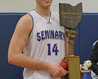 Poland's Jacon Burns (14) smiles while holding the "Battle of 224" trophy after defeating Canfield 53-51 on friday night at Poland High School.  Dustin Livesay  |  The Vindicator  2/12/16  Poland.