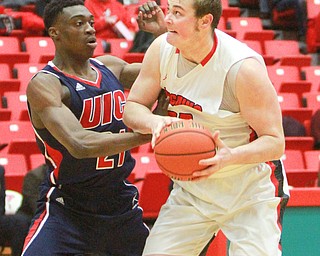 William D Lewis The Vindicator   YSU's Jorden Kaufman(32) and UIC's Tai Odiase(21) during 2-16-16 action at YSU.