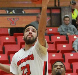 William D Lewis The Vindicator YSU's Francisco santiago(23) scores past UIC's Gabe Snider(2) during 2-16-16 action at YSU.