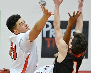 Jeff Lange | The Vindicator  TUE, FEB 16, 2016 - Girard's Julian Berry (left) reaches out for a rebound against Springfield's Nino Esposito (1) during the third quarter of their game at Girard High School on Tuesday.