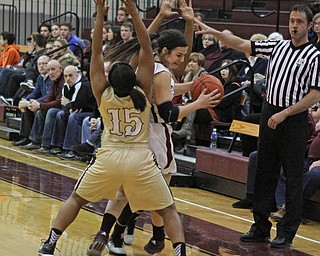 Warren Harding's Aunjanae Warfield (15) and Toni Donaldson (11) force Boardman's Krista Johnson (13) out of bounds during the first quarter of Thursday nights matchup at Boardman High School.  Dustin Livesay  |  The Vindicator  2/18/16  Boardman.