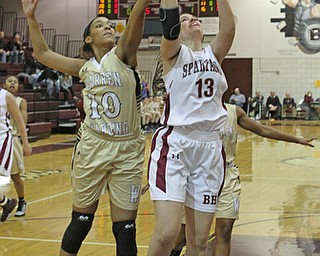 Boardman's Krista Johnson (13) goes up for a layup while being defended by Warren Harding's Shymara Dykes (10) during the first quarter of Thursday nights matchup at Boardman High School.  Dustin Livesay  |  The Vindicator  2/18/16  Boardman.