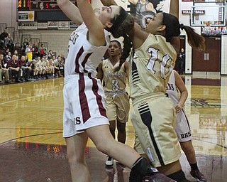 Boardman's Jenna Vivo (5) goes up for a shot while being defended by Warren Harding's Shymara Dykes (10) during the first quarter of Thursday nights matchup at Boardman High School.  Dustin Livesay  |  The Vindicator  2/18/16  Boardman.