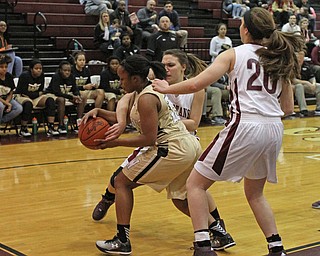 Boardman's Amber McMillan (25) and Lauren Gabriele (20) try to steal the ball from Warren Harding's Aunjanae Warfield (15) during the first quarter of Thursday nights matchup at Boardman High School.  Dustin Livesay  |  The Vindicator  2/18/16  Boardman.