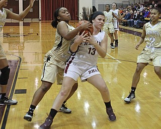 Boardman's Krista Johnson (13) fights for a loose ball with Warren Harding's Aunjanae Warfield (15) during the first quarter of Thursday nights matchup at Boardman High School.  Dustin Livesay  |  The Vindicator  2/18/16  Boardman.