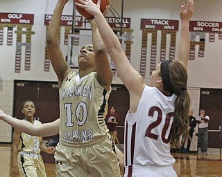 Warren Harding's Shymara Dykes (10) puts up a jump shot while being defended by Boardman's Lauren Gabriele (20) during the second quarter of Thursday nights matchup at Boardman High School.  Dustin Livesay  |  The Vindicator  2/18/16  Boardman.