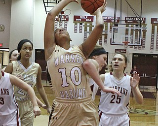 Warren Harding's Shymara Dykes (10) attempts to push through the defense set up by Boardman's Lauren Gabriele (20) during the second quarter of Thursday nights matchup at Boardman High School.  Dustin Livesay  |  The Vindicator  2/18/16  Boardman.