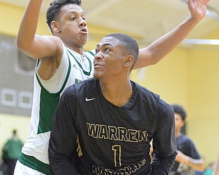 Jeff Lange | The Vindicator THU, FEB 18, 2016 - Warren Harding's Derek Culver (1) has the ball stripped away as he drives to the basket through Ursuline's Devin Harden in the first half of their game at Ursuline High School on Thursday.