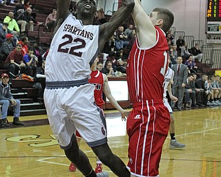 Boardman's Ayo Ojewale (22) gets his layup blocked by Austintown Fitch's Anthony Pangio (11) during the first quarter of Friday nights matchup at Boardman High School.  Dustin Livesay  |  The Vindicator  2/19/16  Boardman High School.